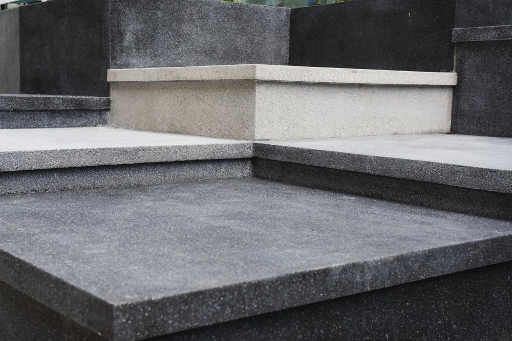 A heavy, solid concrete or slate foundation block